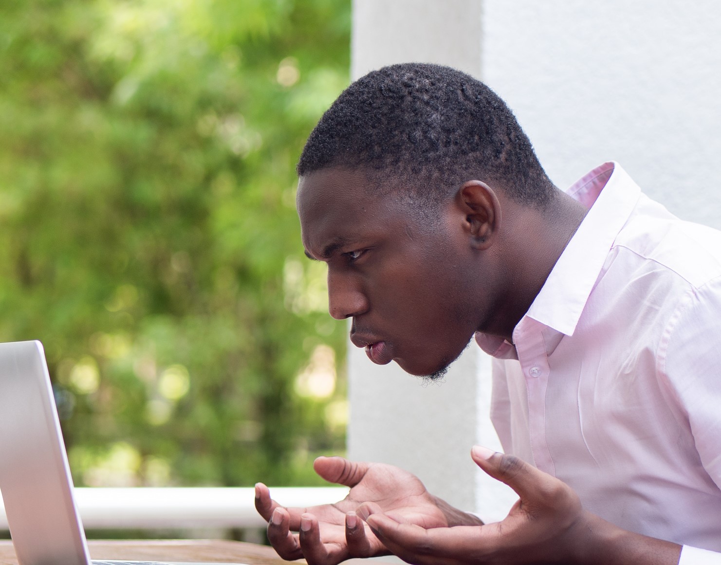 man upset at laptop